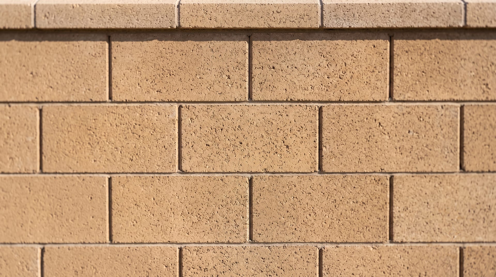 Block wall close-up after efflorescence removal, texture intact