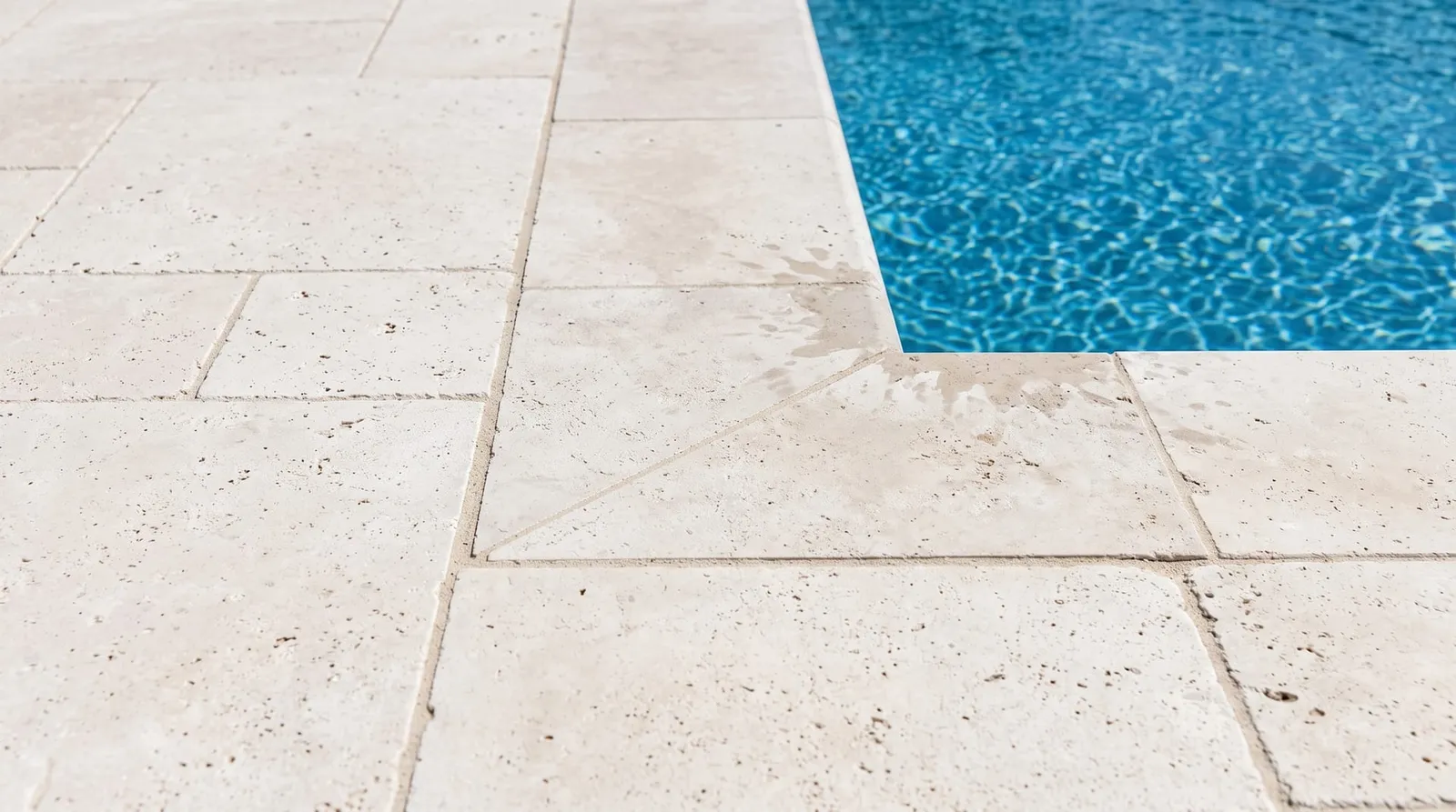 Same travertine clean but unsealed, dry and pale