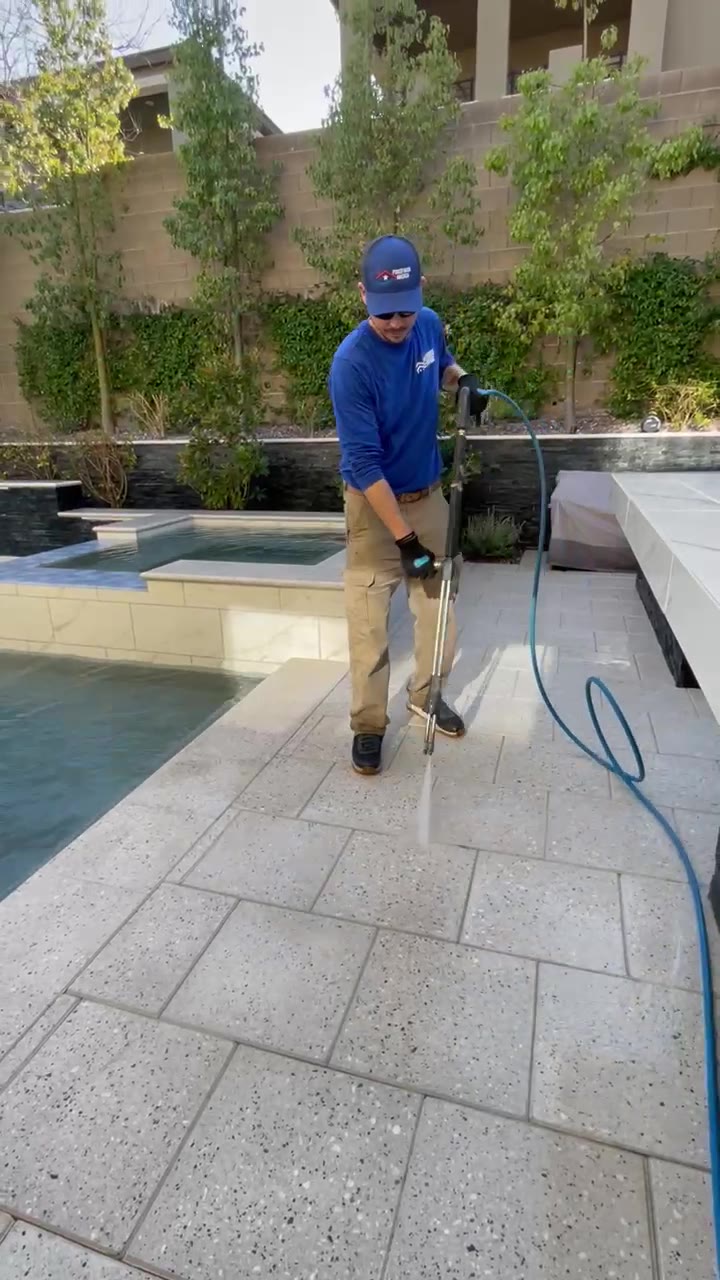 Tony Cuomo, owner of Power Wash America, pressure washing a pool deck in Las Vegas